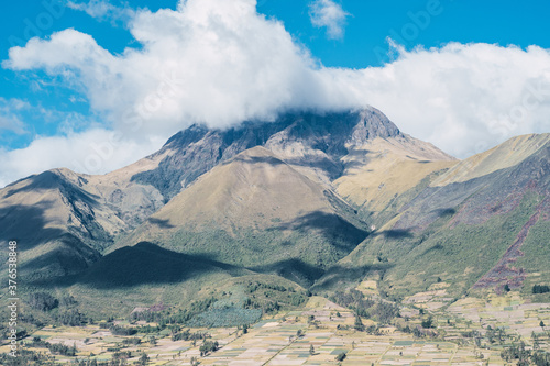 Imbabura Volcano situated in the north of ecuador with a beutiful blue sky in the background with some clouds photo