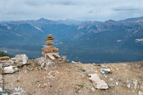 Inuksuk (inukshuk) on a mountain top above the town of Golden, British Columbia, Canada