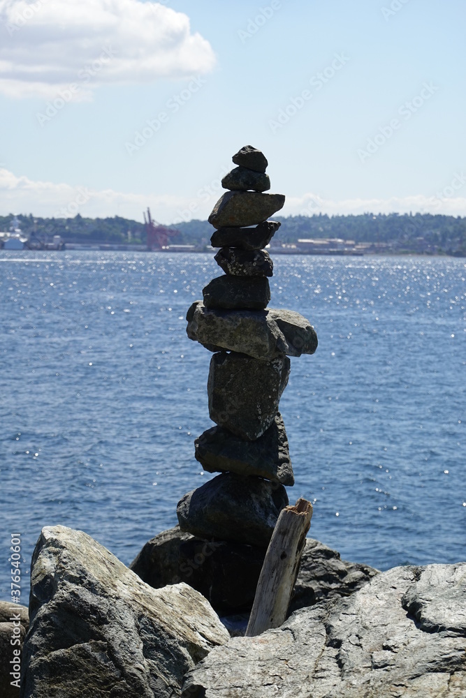 Stone overlap on the beach against the blue sky. Stone overlap on the beach against the blue sky.