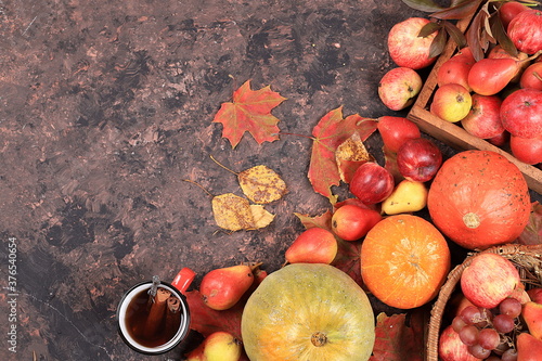 Autumn background with seasonal pears, pumpkins, apples and flowers on a wooden background, top view, copy space, flat lay. Happy Thanksgiving concept, photo