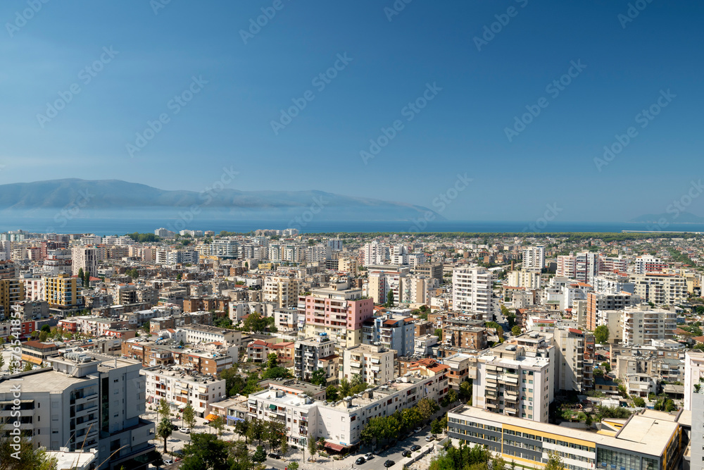 Albania, Vlore, cityscape seen from Kuzum Baba hill. Aerial city view, city panorama of Vlore with the monument of the partisans