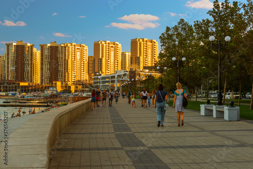 Urban landscape,the seaside promenade of the city in the evening before sunset © Владимир Ушаров