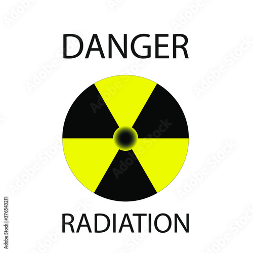 yellow-black radioactive sign with the inscription in black color "danger radiation"