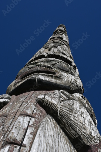 Photography Seattle waterfront historical marker, Native
American sculpture.