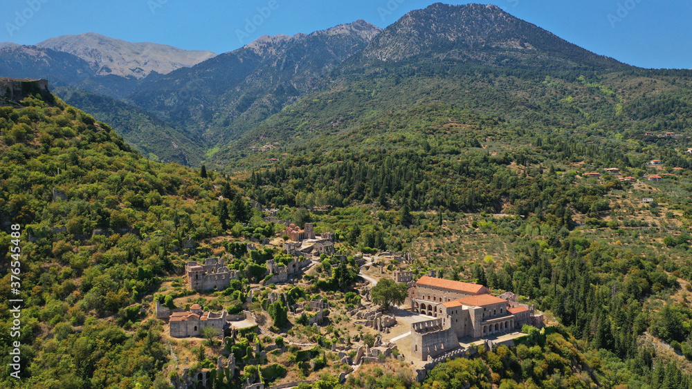 Aerial drone photo of medieval byzantine old city of Mystras featuring Monastery of Pantanassa, Temple of Agia Sofia and uphill castle of Mystras, Sparta, Peloponnese, Greece Aerial drone photo of medieval byzantine old city of Mystras featuring Monastery of Pantanassa, Temple of Agia Sofia and uphill castle of Mystras, Sparta, Peloponnese, Greece