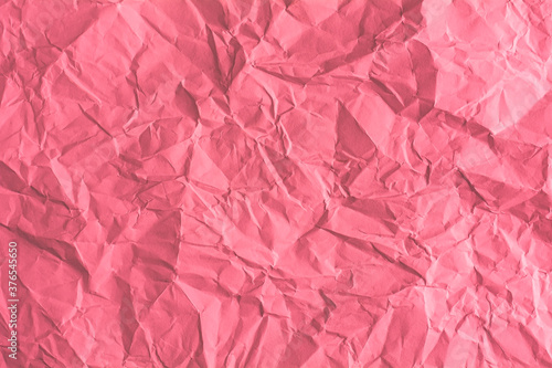 Red paper is wrinkled in the background.