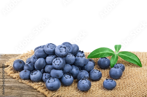 fresh blueberry on wooden table isolated on white background closeup. Clipping path and full depth of field