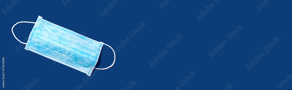 Blue surgical mask overhead view - flat lay Blue surgical mask overhead view - flat lay