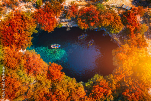 Melissani Cave with autumn colors. Famous Melissani lake on Kefalonia island, Karavomylos, Greece. On top of Melissani Cave (Melissani Lake) in Karavomylos village in Kefalonia island , Greece. © daliu