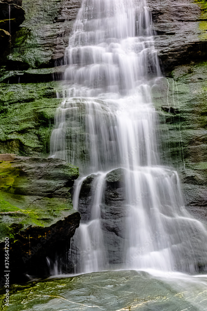 Fototapeta premium Tintagel Haven beach waterfall - Tintagel, Cornwall, United Kingdom