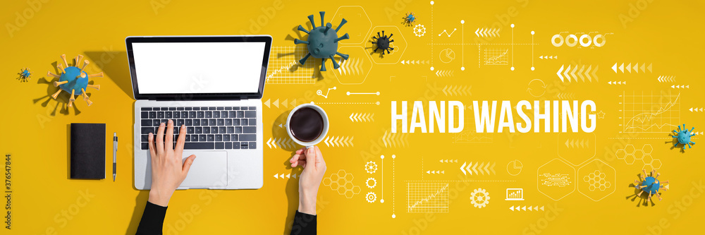 Hand washing theme with person using a laptop computer Hand washing theme with person using a laptop computer