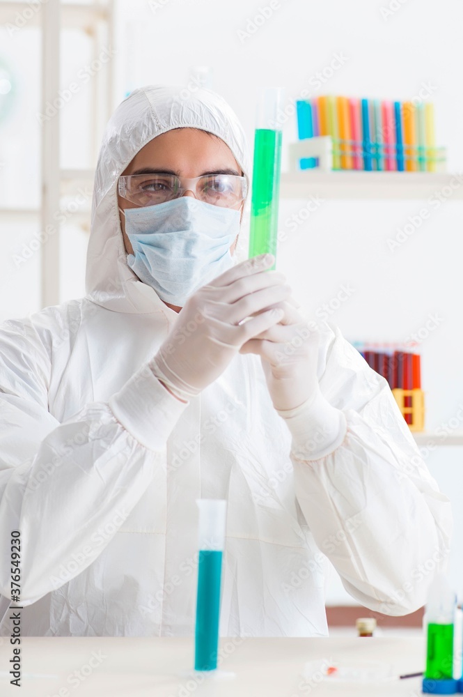 Young chemist student working in lab on chemicals Young chemist student working in lab on chemicals