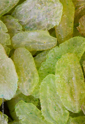 super macro shot of exotic green vientamese rice flakes from Asia in details very close. Ideal food and spice background photo