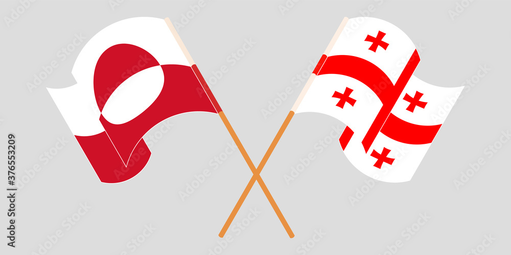 Crossed and waving flags of Greenland and Georgia Crossed and waving flags of Greenland and Georgia