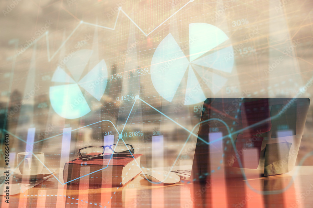 Double exposure of financial chart drawings and desk with open notebook background. Concept of forex market Double exposure of financial chart drawings and desk with open notebook background. Concept of forex market