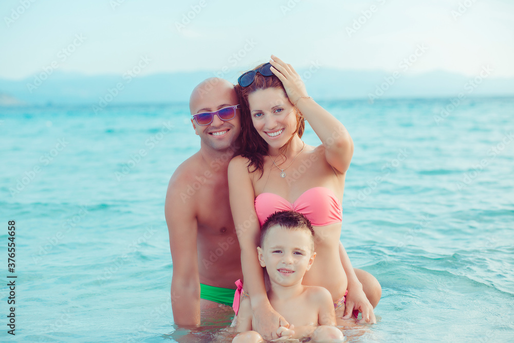 Happy family on the oceanfront, outdoors Happy family on the oceanfront, outdoors