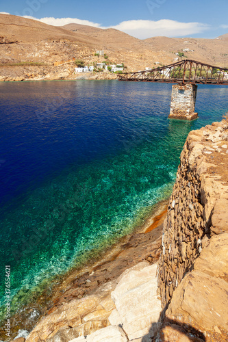 Megalo Livadi, a picturesque bay in Serifos island, Cyclades, Greece. There is a metal bridge where mines were loaded from the local mine.