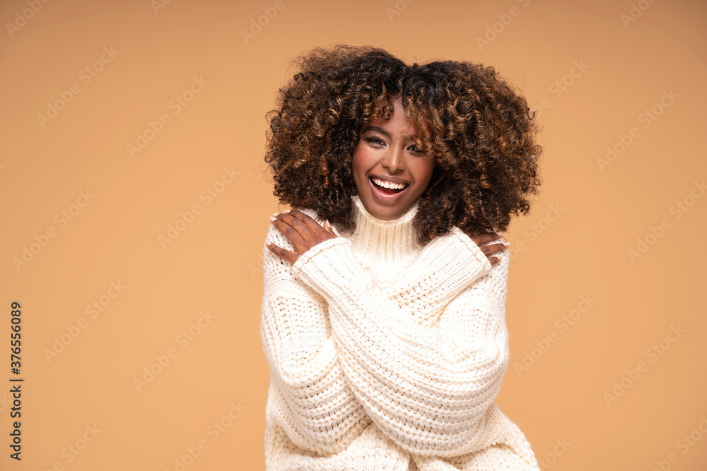 Afro girl in cozy fashionable sweater. Afro girl in cozy fashionable sweater.