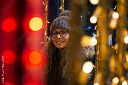 Portrait of young girl with Christmas lights