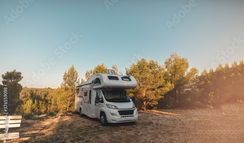 campervan caravan vehicle for van life holiday on mobile home camper mobile motor home RV campervan for an outdoor nomad lifestyle camper van journey camping in the parking in the forest photo