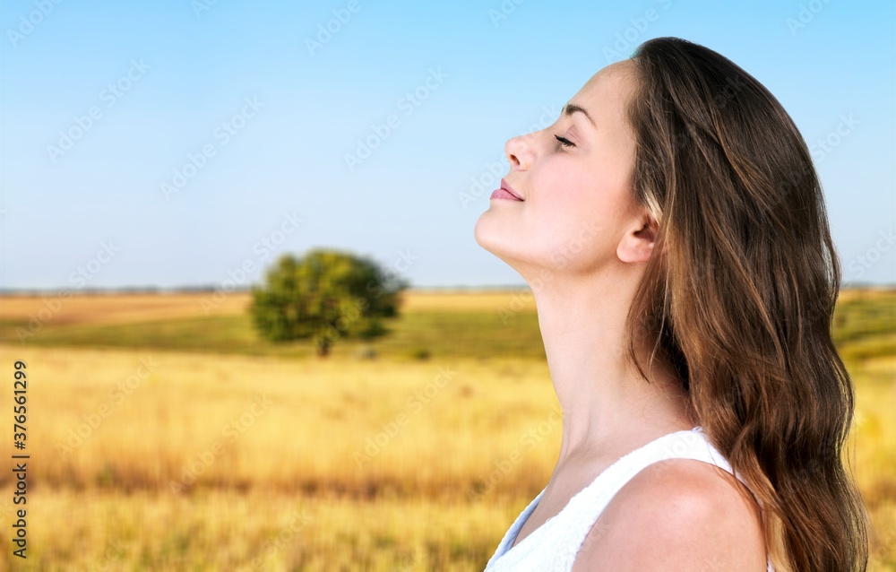 Happy young woman with perfect skin on outdoor background Happy young woman with perfect skin on outdoor background