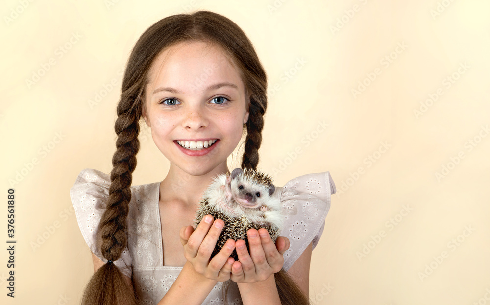 Happy little child girl with cute hedgehog. Happy little child girl with cute hedgehog.