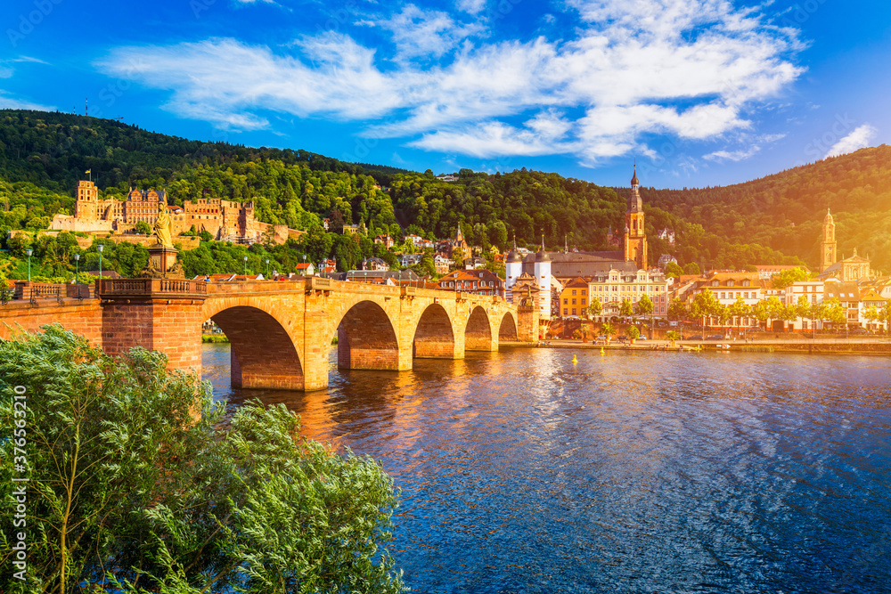 Fototapeta premium Landmark and beautiful Heidelberg town with Neckar river, Germany. Heidelberg town with the famous Karl Theodor old bridge and Heidelberg castle, Heidelberg, Germany.