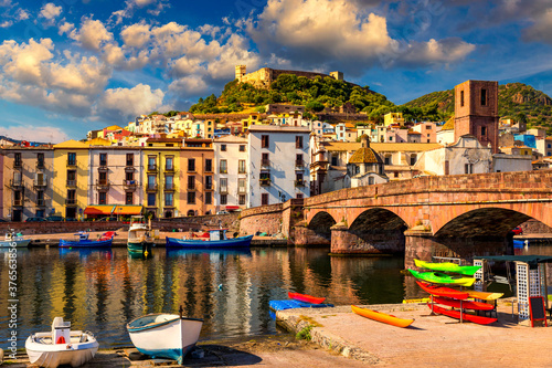 Beautiful view of Bosa town, Sardinia island, Italy. Travel destination. Bosa town with Ponte Vecchio bridge across the Temo river. Marvelous morning view of Sardinia island, Italy, Europe. photo