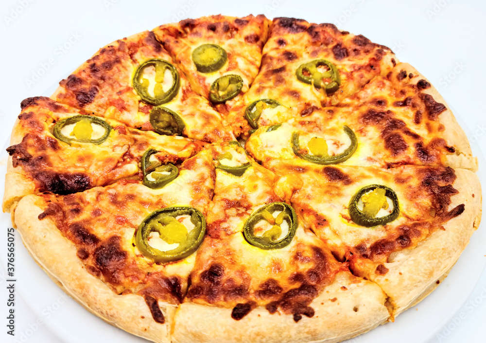 Homemade pizza ; Jalapenos pickle on cheese pizza crust on white plate in white background