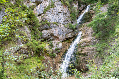 view on lainbach waterfall in summertime near mittenwald, bavaria, germany photo