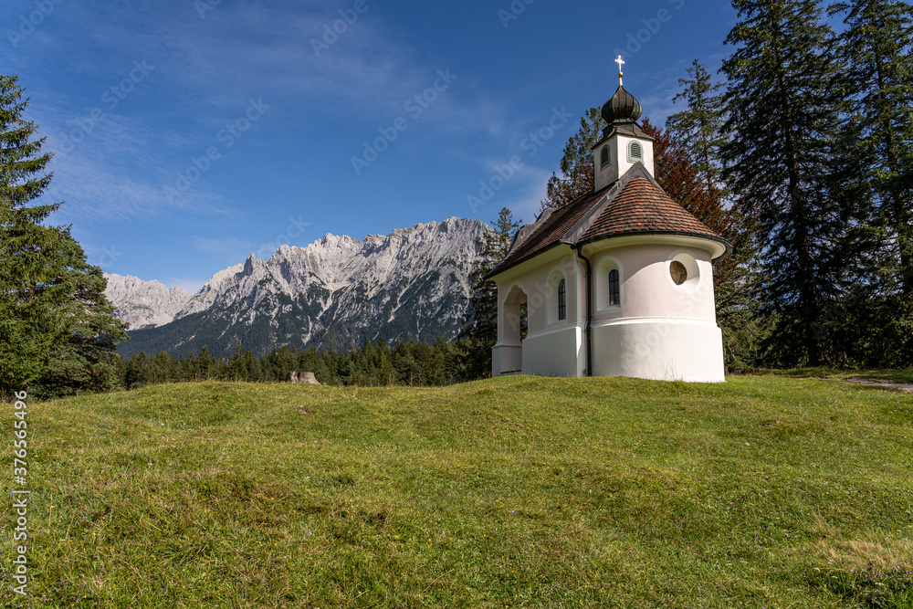 view on karwendel mountains and the chapel maria koenigin (queen maria), bavaria, germany