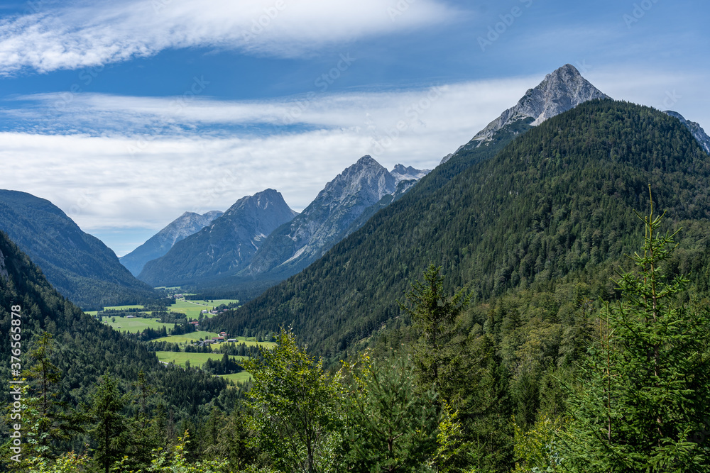 view on wetterstein mountains and leutasch valley from ederkanzel guest court restaurant in summer