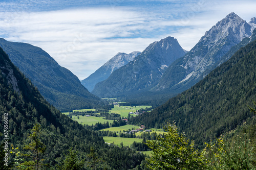 view on wetterstein mountains and leutasch valley from ederkanzel guest court restaurant in summer © Alexander