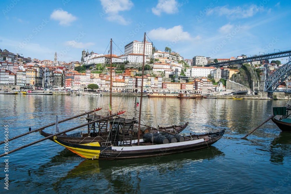 Fototapeta premium Porto city, Portugal. View of the river, with the boats and the city in the background