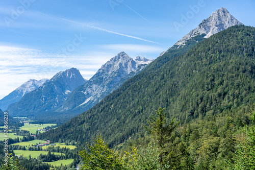 view on wetterstein mountains and leutasch valley from ederkanzel guest court restaurant in summer © Alexander