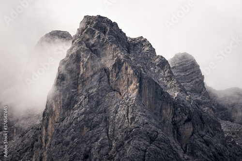 mountain panorama of the karwendel mountains with clouds photo taken at the barmsee