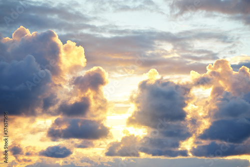 Canvas Print Epic sunset sky with colorful glowing clouds after thunderstorm