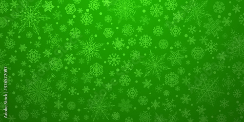 Christmas background of various complex big and small snowflakes, in green colors