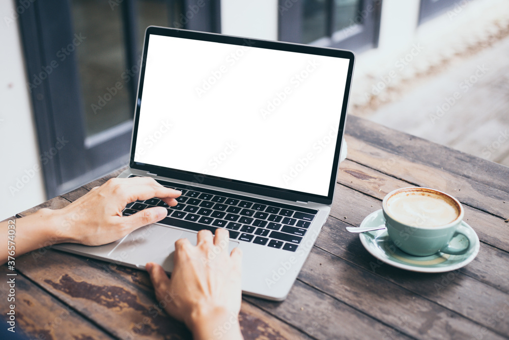 computer mockup blank screen.hand woman work using laptop with white background for advertising,contact business search information on desk at coffee shop.marketing and creative design computer mockup blank screen.hand woman work using laptop with white background for advertising,contact business search information on desk at coffee shop.marketing and creative design