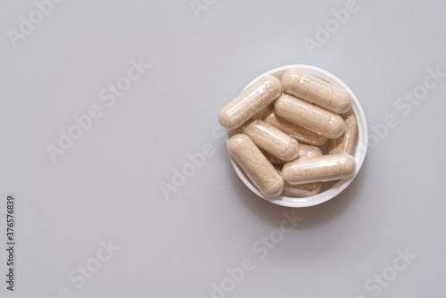 vegetarian capsules laid on white table isolated photo