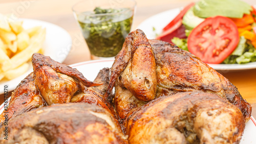 grilled chicken with salad and french fries - peruvian food photo