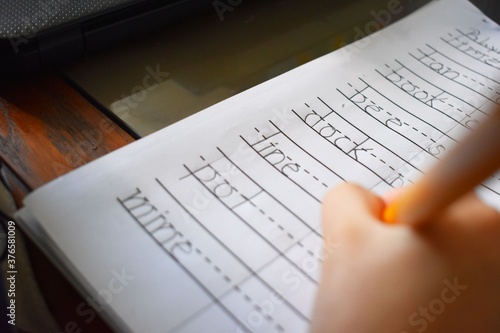 Words in a notebook kid doing homeschooling