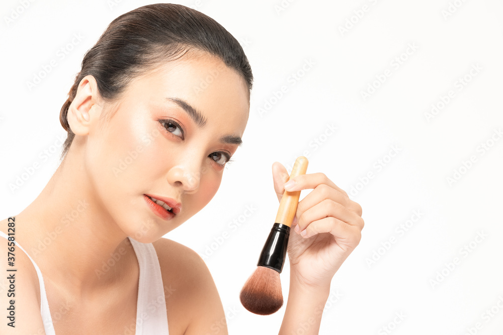 Beauty asian woman hold make up brush and cheerful with make up brush Beauty asian woman hold make up brush and cheerful with make up brush