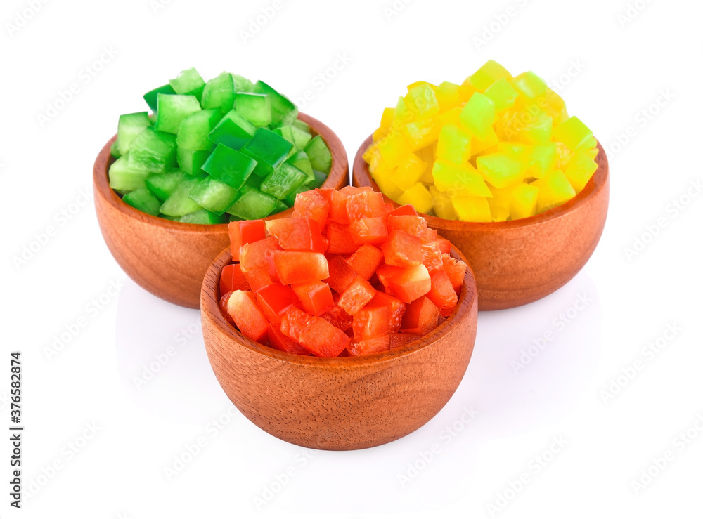 Sliced bell pepper in a wooden bowl. - Image