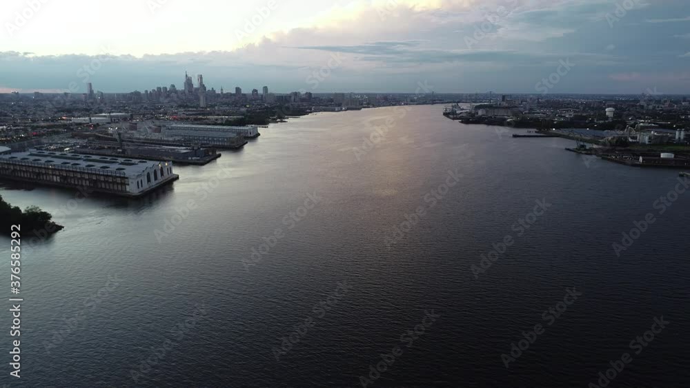 Aerial Drone View Flying Over Delaware River towards City of Philadelphia at Dusk Aerial Drone View Flying Over Delaware River towards City of Philadelphia at Dusk