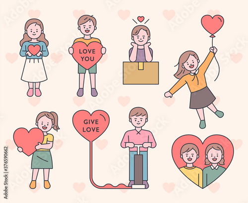 Cute characters are holding hearts. flat design style minimal vector illustration.