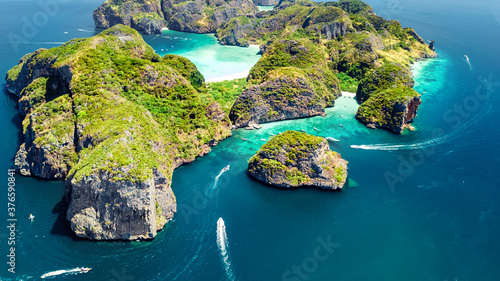Aerial drone view of tropical Ko Phi Phi island, beaches and boats in blue clear Andaman sea water from above, beautiful archipelago islands of Krabi, Thailand 