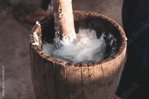 Canvas Print A tribal tradition that runs once a year is pounding Pook rice to preserve the t