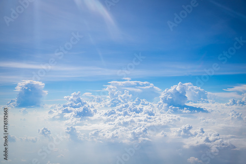 Sky and clouds from above the ground viewed from an airplane