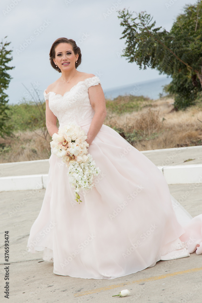 Latino Bride and groom with white tuxedo Latino Bride and groom with white tuxedo
